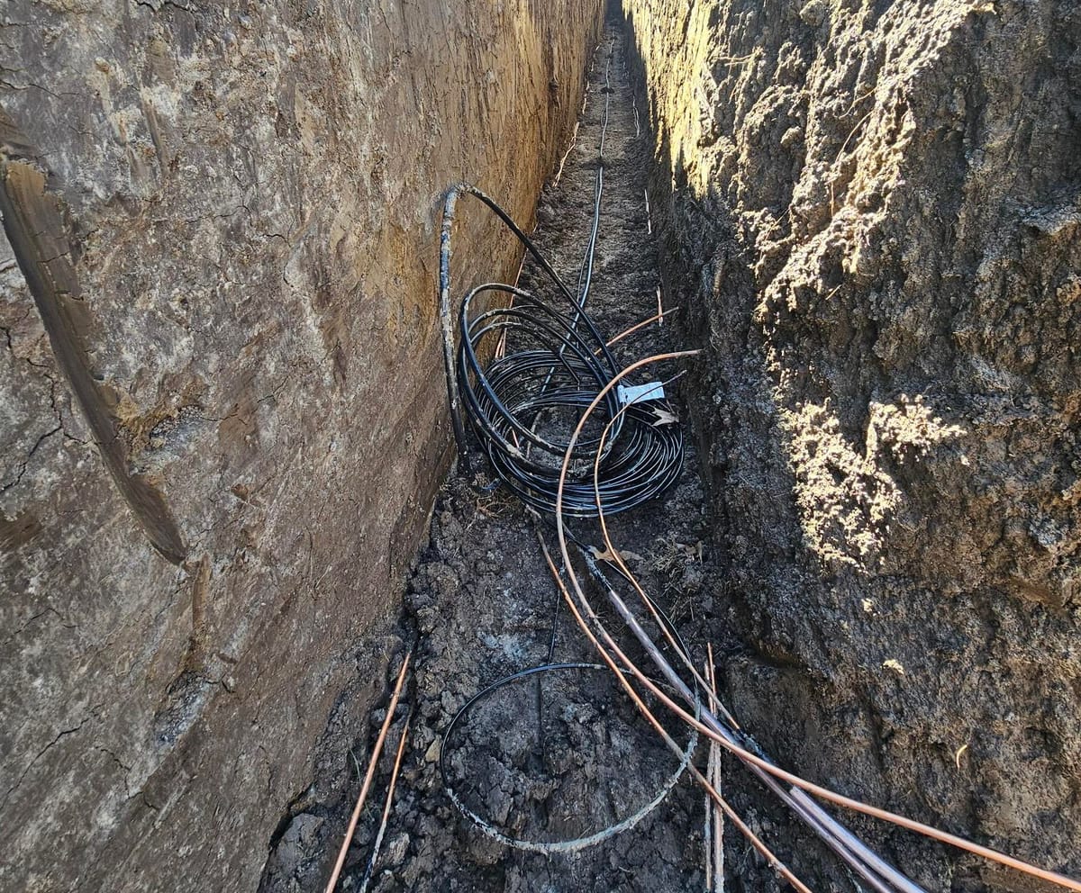 Copper loop tubing laid in a deep trench