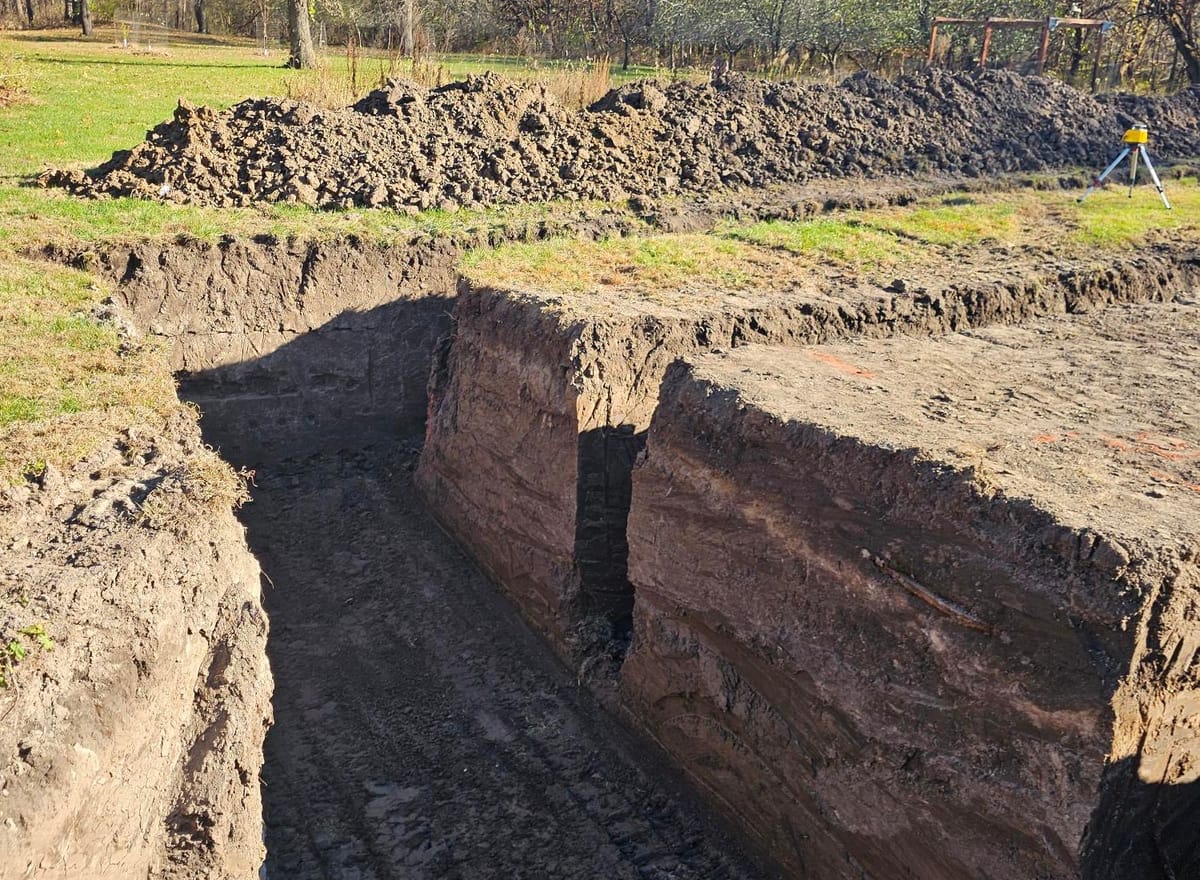 Deep trench & spoil pile on a residential site